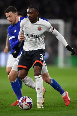 110325 - Cardiff City v Luton Town - Sky Bet Championship - Aaron Ramsey of Cardiff City is challenged by Amari'i Bel of Luton Town