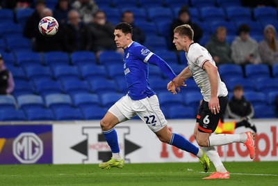 110325 - Cardiff City v Luton Town - Sky Bet Championship - Yousef Salech of Cardiff City is challenged by Mark McGuinness of Luton Town