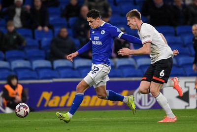 110325 - Cardiff City v Luton Town - Sky Bet Championship - Yousef Salech of Cardiff City is challenged by Mark McGuinness of Luton Town