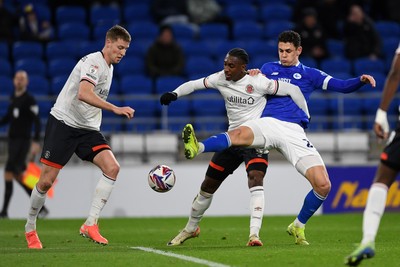 110325 - Cardiff City v Luton Town - Sky Bet Championship - Yousef Salech of Cardiff City is challenged by Amari'i Bel of Luton Town