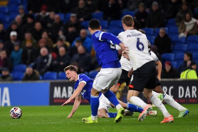 110325 - Cardiff City v Luton Town - Sky Bet Championship - Will Fish of Cardiff City is tackled just outside the box