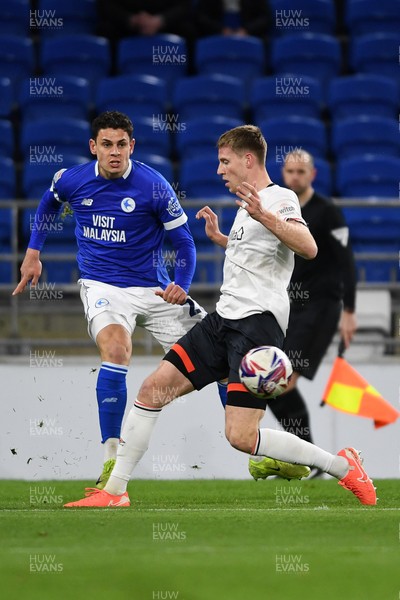 110325 - Cardiff City v Luton Town - Sky Bet Championship - Yousef Salech of Cardiff City is challenged by Mark McGuinness of Luton Town