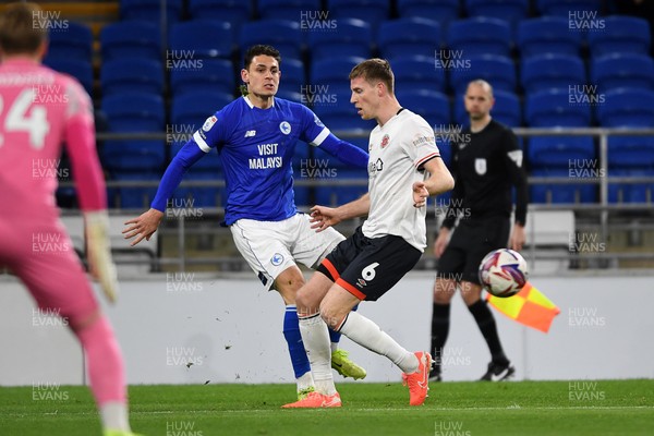 110325 - Cardiff City v Luton Town - Sky Bet Championship - Yousef Salech of Cardiff City is challenged by Mark McGuinness of Luton Town