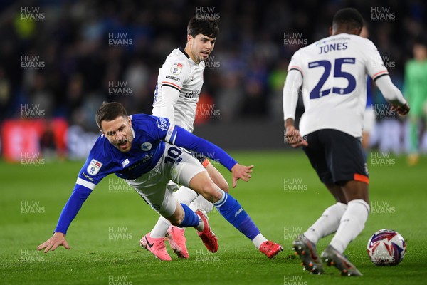 110325 - Cardiff City v Luton Town - Sky Bet Championship - Aaron Ramsey of Cardiff City is challenged by Liam Walsh of Luton Town