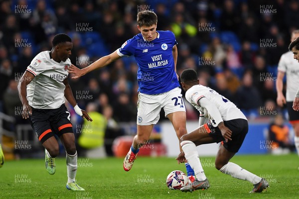 110325 - Cardiff City v Luton Town - Sky Bet Championship - Rubin Colwill of Cardiff City is challenged by Isaiah Jones of Luton Town