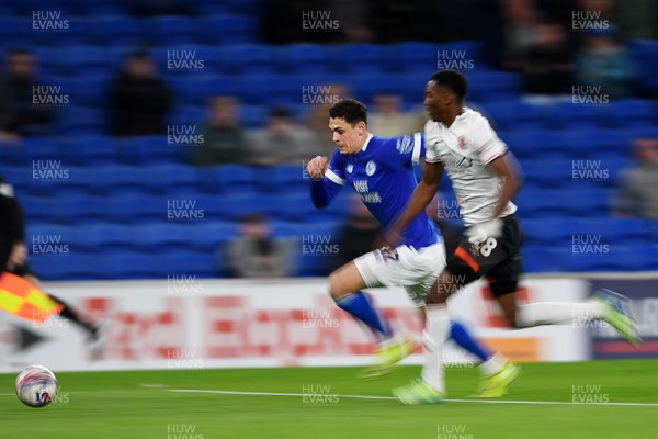 110325 - Cardiff City v Luton Town - Sky Bet Championship - Yousef Salech of Cardiff City is chased down by Christ Makosso of Luton Town