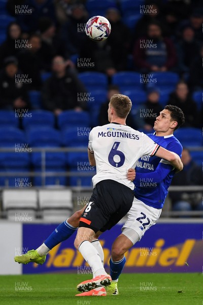 110325 - Cardiff City v Luton Town - Sky Bet Championship - Yousef Salech of Cardiff City is challenged by Mark McGuinness of Luton Town