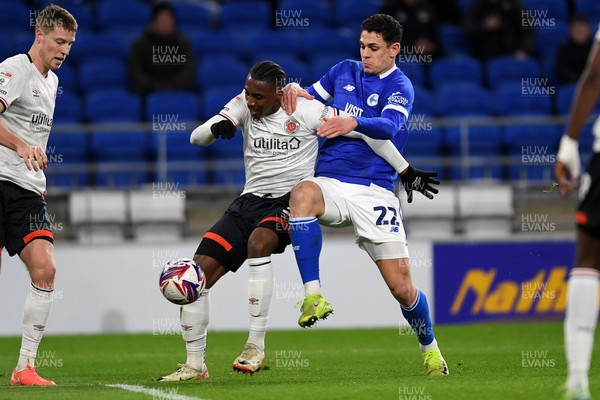 110325 - Cardiff City v Luton Town - Sky Bet Championship - Yousef Salech of Cardiff City is challenged by Amari'i Bel of Luton Town