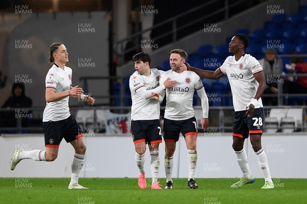 110325 - Cardiff City v Luton Town - Sky Bet Championship - Christ Makosso of Luton Town celebrates scoring the equalising goal with team mates