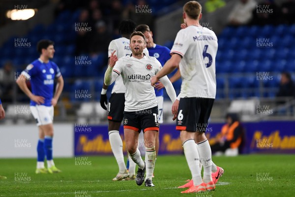 110325 - Cardiff City v Luton Town - Sky Bet Championship - Christ Makosso of Luton Town celebrates scoring the equalising goal with team mates