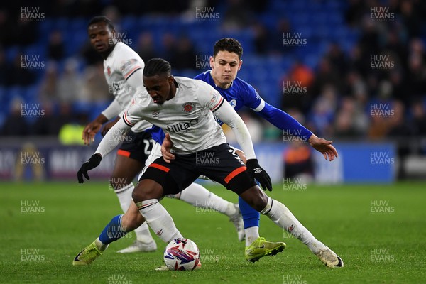 110325 - Cardiff City v Luton Town - Sky Bet Championship - Yousef Salech of Cardiff City is challenged by Amari'i Bel of Luton Town