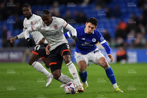 110325 - Cardiff City v Luton Town - Sky Bet Championship - Yousef Salech of Cardiff City is challenged by Amari'i Bel of Luton Town