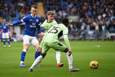 140226 - Cardiff City v Luton Town - Sky Bet League 1 - David Turnbull of Cardiff City is challenged by Isaiah Jones of Luton