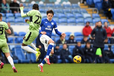 140226 - Cardiff City v Luton Town - Sky Bet League 1 - Perry NG of Cardiff City is challenged by Devante Cole of Luton