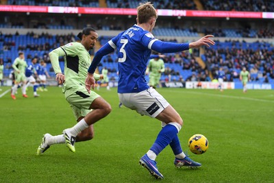 140226 - Cardiff City v Luton Town - Sky Bet League 1 - Joel Bagan of Cardiff City is tackled by Nigel Lonwijk of Luton