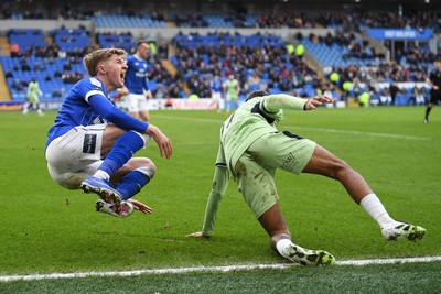 140226 - Cardiff City v Luton Town - Sky Bet League 1 - Joel Bagan of Cardiff City is tackled by Nigel Lonwijk of Luton