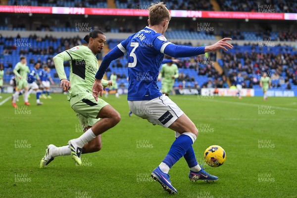 140226 - Cardiff City v Luton Town - Sky Bet League 1 - Joel Bagan of Cardiff City is tackled by Nigel Lonwijk of Luton