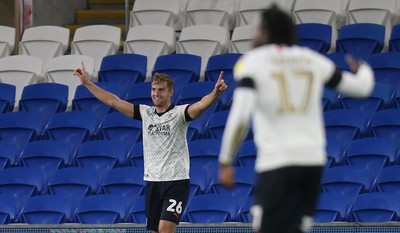 270819 - Cardiff City v Luton Town, EFL  Cup, Round 2 - James Bree of Luton Town celebrates after Junior Hoilett of Cardiff City, right, puts the ball into his own net to score own goal