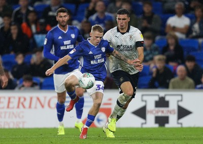 270819 - Cardiff City v Luton Town, EFL  Cup, Round 2 - James Waite of Cardiff City looks to win the ball as Lloyd Jones of Luton Town challenges