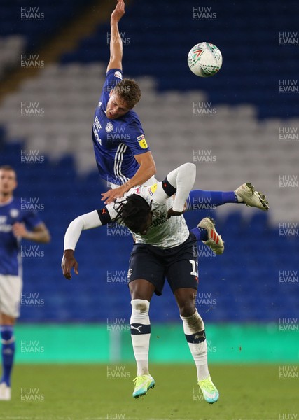 270819 - Cardiff City v Luton Town, EFL  Cup, Round 2 - Will Vaulks of Cardiff City gets above Pelly-Ruddock Mpanza of Luton Town to head the ball