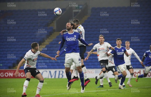 281120 - Cardiff City v Luton Town, Sky Bet Championship - Sean Morrison of Cardiff City beats Sonny Bradley of Luton Town to head the ball