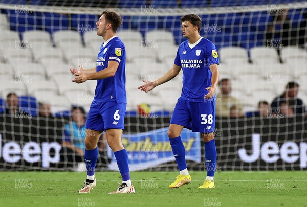 300822 - Cardiff City v Luton Town - SkyBet Championship - A dejected Ryan Wintle and Perry Ng of Cardiff City