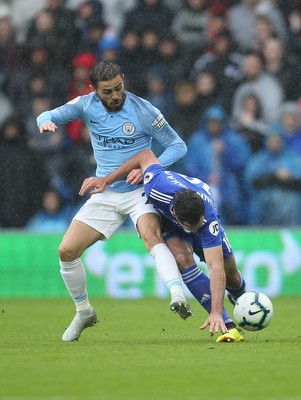 220918 - Cardiff City v Manchester City, Premier League - Bernardo Silva of Manchester City and Greg Cunningham of Cardiff City compete for the ball