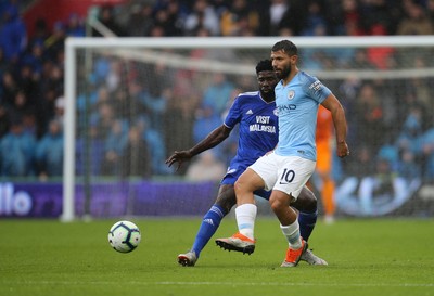 220918 - Cardiff City v Manchester City, Premier League - Sergio Aguero of Manchester City is challenged by Bruno Ecuele Manga of Cardiff City