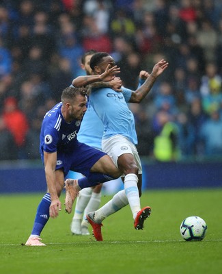 220918 - Cardiff City v Manchester City, Premier League - Joe Ralls of Cardiff City and Raheem Sterling of Manchester City compete for the ball