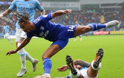 220918 - Cardiff City v Manchester City, Premier League - Bobby Decordova-Reid of Cardiff City is tackled by Nicolas Otamendi of Manchester City