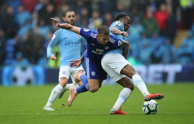 220918 - Cardiff City v Manchester City, Premier League - Joe Ralls of Cardiff City and Raheem Sterling of Manchester City compete for the ball