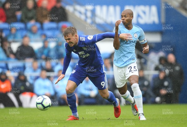220918 - Cardiff City v Manchester City, Premier League - Danny Ward of Cardiff City and Fernandinho of Manchester City compete for the ball