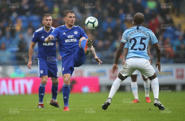 220918 - Cardiff City v Manchester City, Premier League - Danny Ward of Cardiff Citywins the ball from Fernandinho of Manchester City