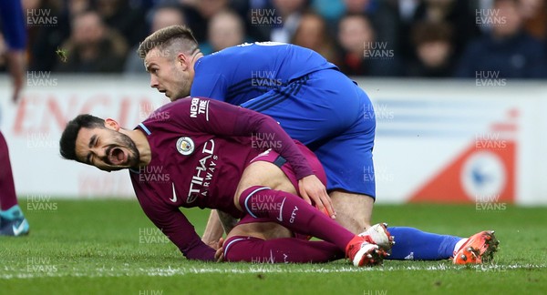 280118 - Cardiff City v Manchester City - FA Cup - Ilkay Gundogan of Manchester City goes down after being tackled by Joe Ralls of Cardiff City