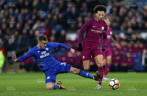 280118 - Cardiff City v Manchester City - FA Cup - Leroy Sane of Manchester City is tackled by Joe Bennett of Cardiff City
