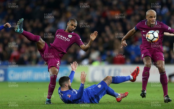 280118 - Cardiff City v Manchester City - FA Cup - Fernandinho of Manchester City and Callum Paterson of Cardiff City clash
