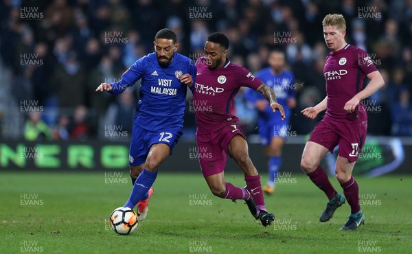 280118 - Cardiff City v Manchester City - FA Cup - Liam Feeney of Cardiff City is tackled by Raheem Sterling of Manchester City