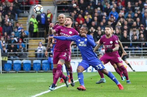 280118 - Cardiff City v Manchester City, Emirates FA Cup Fourth Round - Junior Hoilett of Cardiff City and Kyle Walker of Manchester City compete for the ball