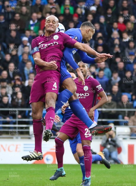 280118 - Cardiff City v Manchester City, Emirates FA Cup Fourth Round - Vincent Kompany of Manchester City  and Kenneth Zohore of Cardiff City compete for the ball