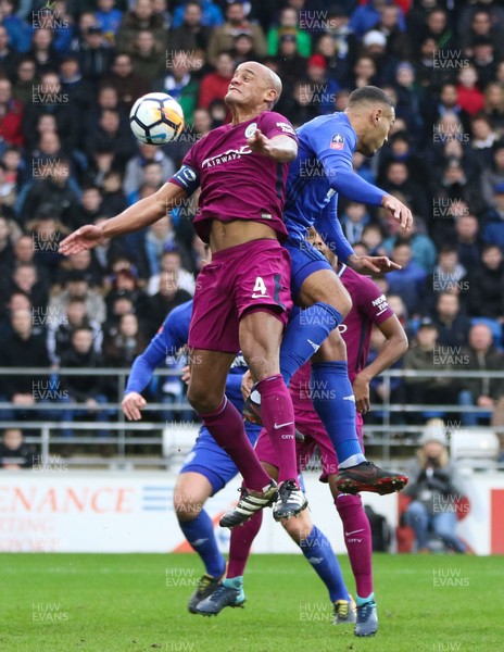 280118 - Cardiff City v Manchester City, Emirates FA Cup Fourth Round - Vincent Kompany of Manchester City  and Kenneth Zohore of Cardiff City compete for the ball