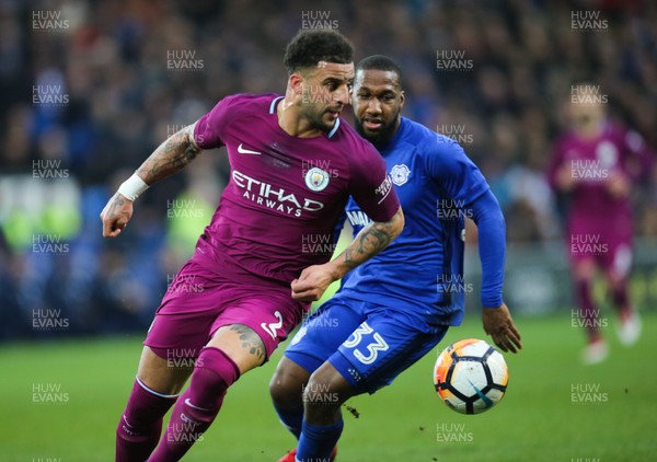 280118 - Cardiff City v Manchester City, Emirates FA Cup Fourth Round - Kyle Walker of Manchester City holds off Junior Hoilett of Cardiff City