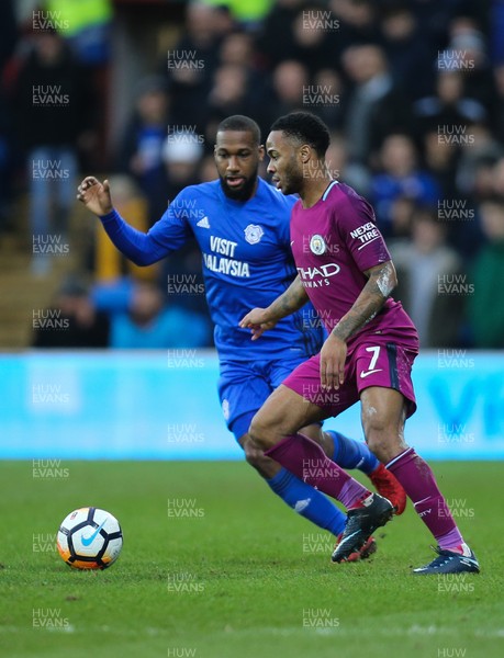 280118 - Cardiff City v Manchester City, Emirates FA Cup Fourth Round - Junior Hoilett of Cardiff City challenges Raheem Sterling of Manchester City