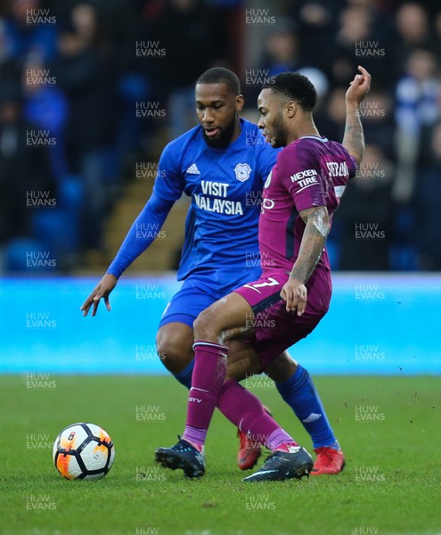 280118 - Cardiff City v Manchester City, Emirates FA Cup Fourth Round - Junior Hoilett of Cardiff City challenges Raheem Sterling of Manchester City