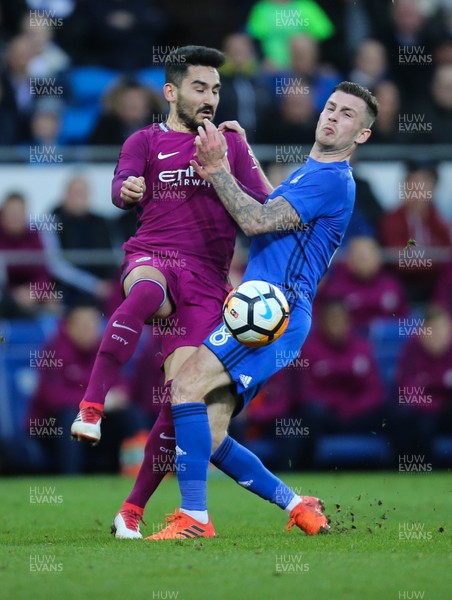 280118 - Cardiff City v Manchester City, Emirates FA Cup Fourth Round - Joe Ralls of Cardiff City and Ilkay Gundogan of Manchester City compete for the ball