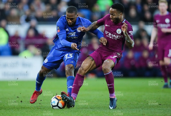 280118 - Cardiff City v Manchester City, Emirates FA Cup Fourth Round - Junior Hoilett of Cardiff City is challenged by Raheem Sterling of Manchester City