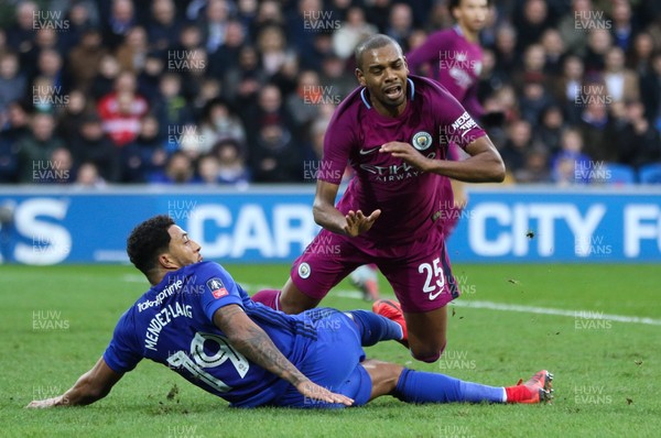 280118 - Cardiff City v Manchester City, Emirates FA Cup Fourth Round - Fernandinho of Manchester City is brought down by Nathaniel Mendez-Laing of Cardiff City