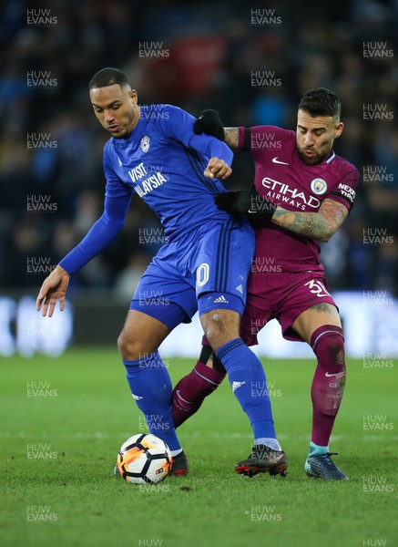 280118 - Cardiff City v Manchester City, Emirates FA Cup Fourth Round - Kenneth Zohore of Cardiff City and Nicolas Otamendi of Manchester City compete for the ball