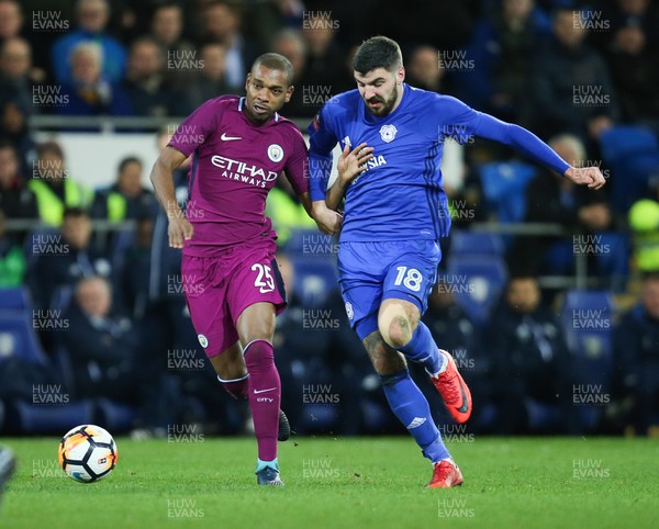 280118 - Cardiff City v Manchester City, Emirates FA Cup Fourth Round - Fernandinho of Manchester City and Callum Paterson of Cardiff City compete for the ball