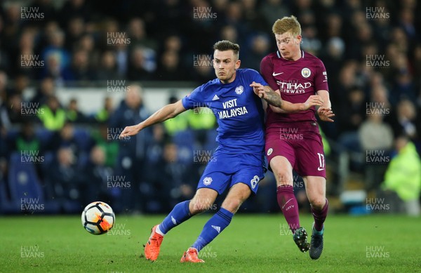 280118 - Cardiff City v Manchester City, Emirates FA Cup Fourth Round - Joe Ralls of Cardiff City and Kevin De Bruyne of Manchester City compete for the ball