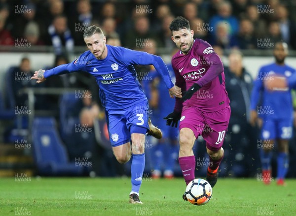 280118 - Cardiff City v Manchester City, Emirates FA Cup Fourth Round - Sergio Aguero of Manchester City holds off Joe Bennett of Cardiff City